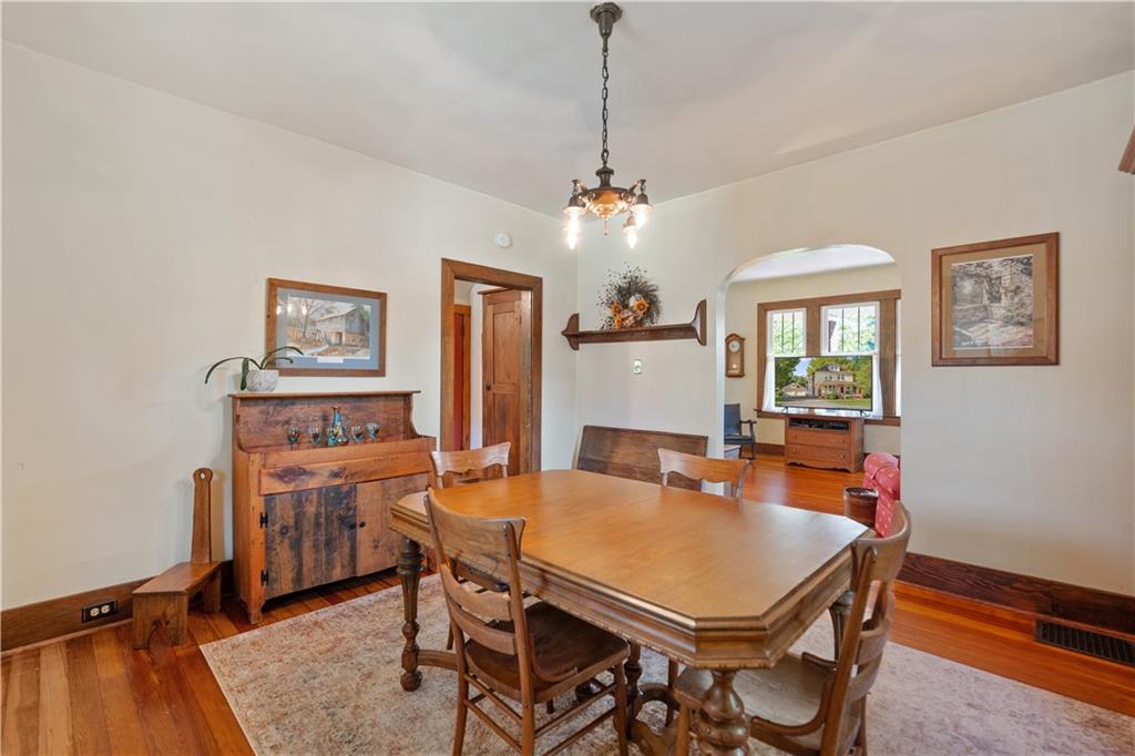 645 Cemetery Road Perryopolis, PA 15473 - Photo 16 of 31 a view of a dining room with furniture and a chandelier