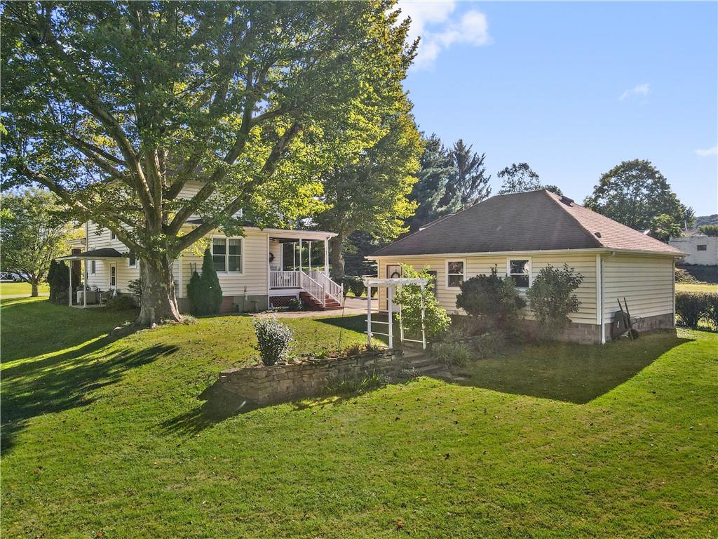 645 Cemetery Road Perryopolis, PA 15473 - Photo 2 of 31 a view of a house with a yard