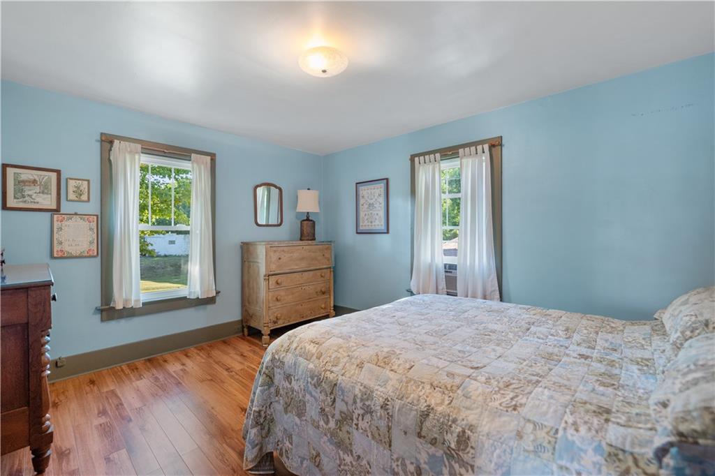 645 Cemetery Road Perryopolis, PA 15473 - Photo 24 of 31 a bedroom with a bed and a dresser next to a window