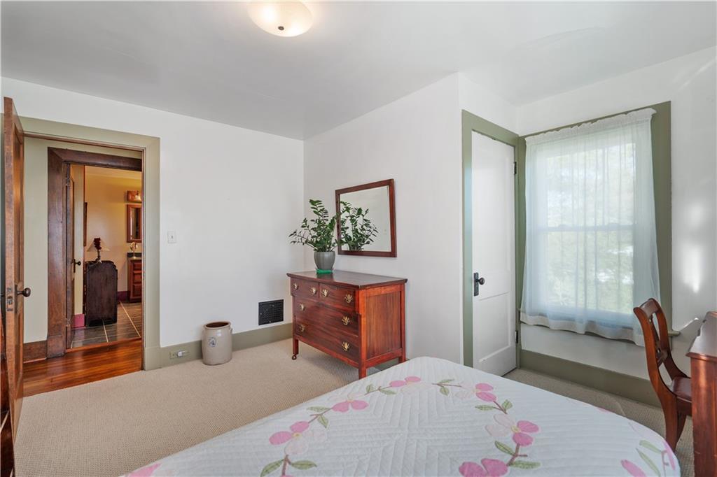 645 Cemetery Road Perryopolis, PA 15473 - Photo 27 of 31 a bedroom with a bed and wooden floor