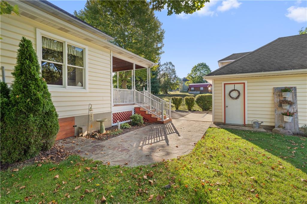 645 Cemetery Road Perryopolis, PA 15473 - Photo 4 of 31 a view of a house with a patio