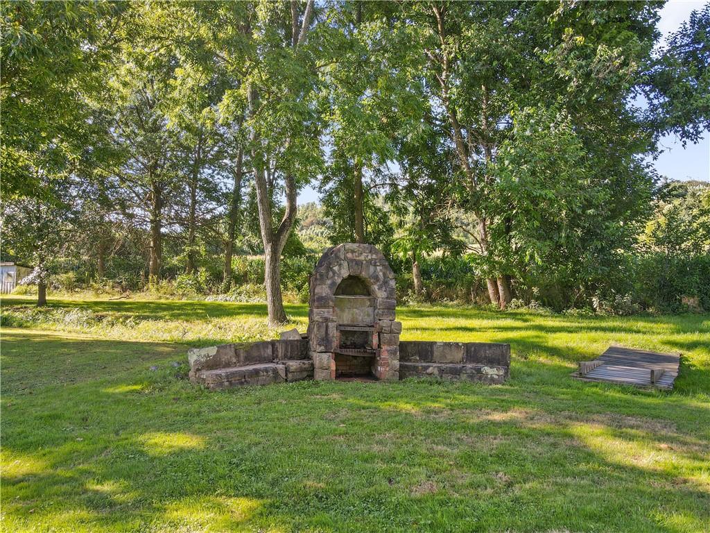 645 Cemetery Road Perryopolis, PA 15473 - Photo 5 of 31 a view of a swimming pool with an outdoor space and seating area