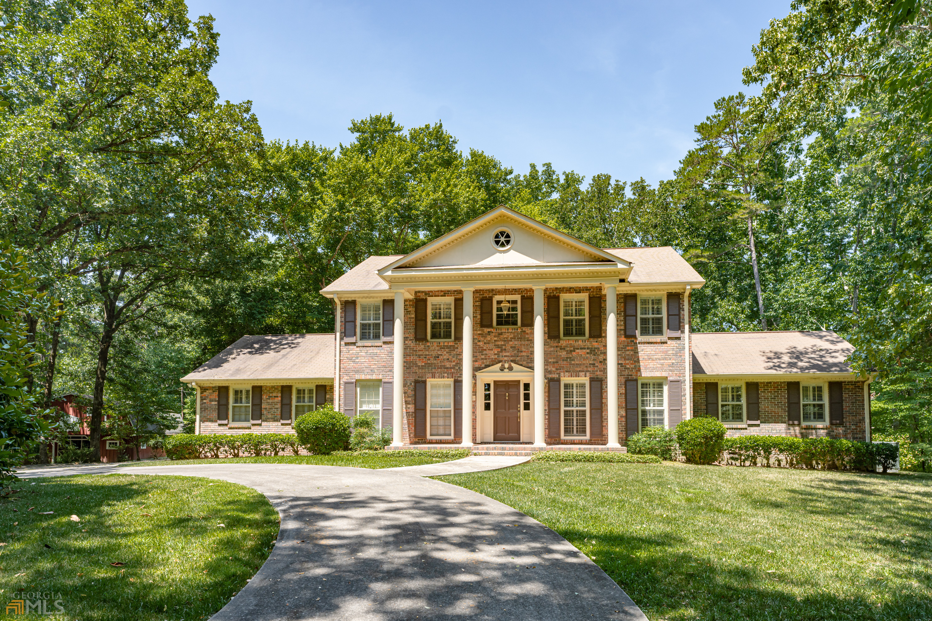 94 Quiet Acres Road Southwest Rome, GA 30165 - Photo 1 of 1 a front view of a house with a garden
