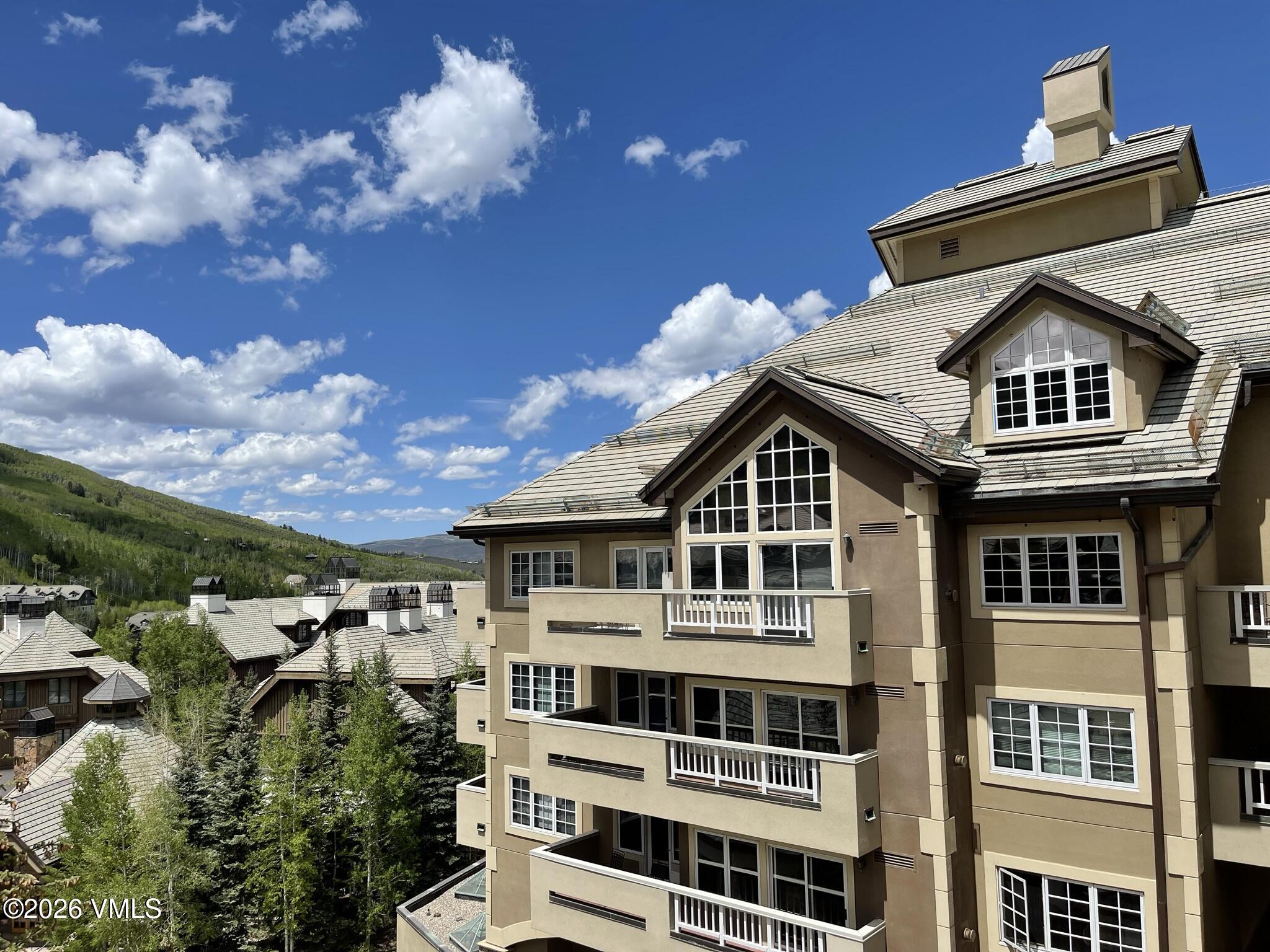 210 Offerson Road, Unit R317 WEEK 4 Beaver Creek, CO 81620 - Photo 4 of 29 a front view of a residential apartment building with a yard