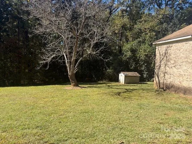 a house with trees in the background