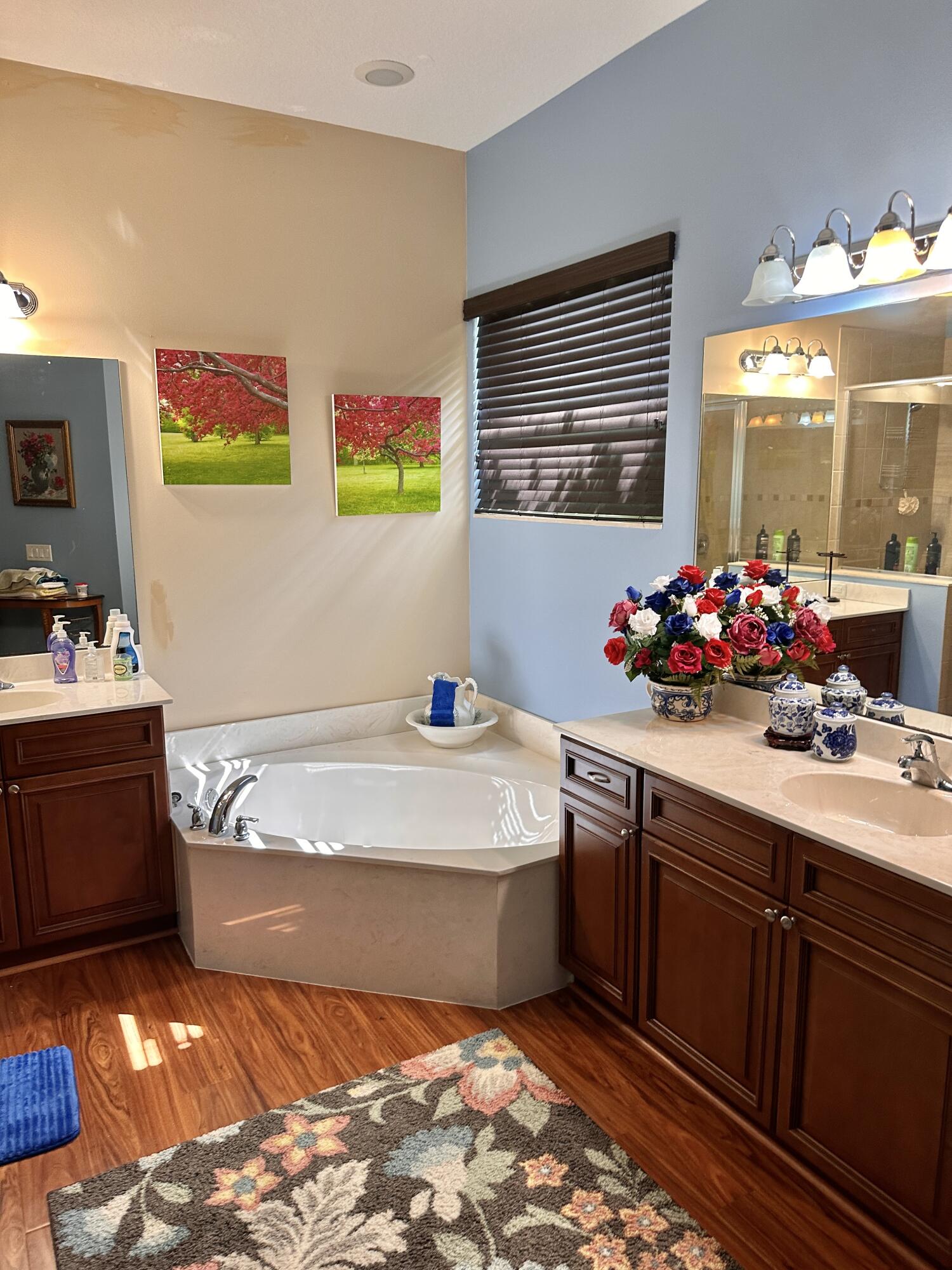 14085 86th Road North Loxahatchee, FL 33470 - Photo 22 of 28 a bathroom with a sink mirror and window