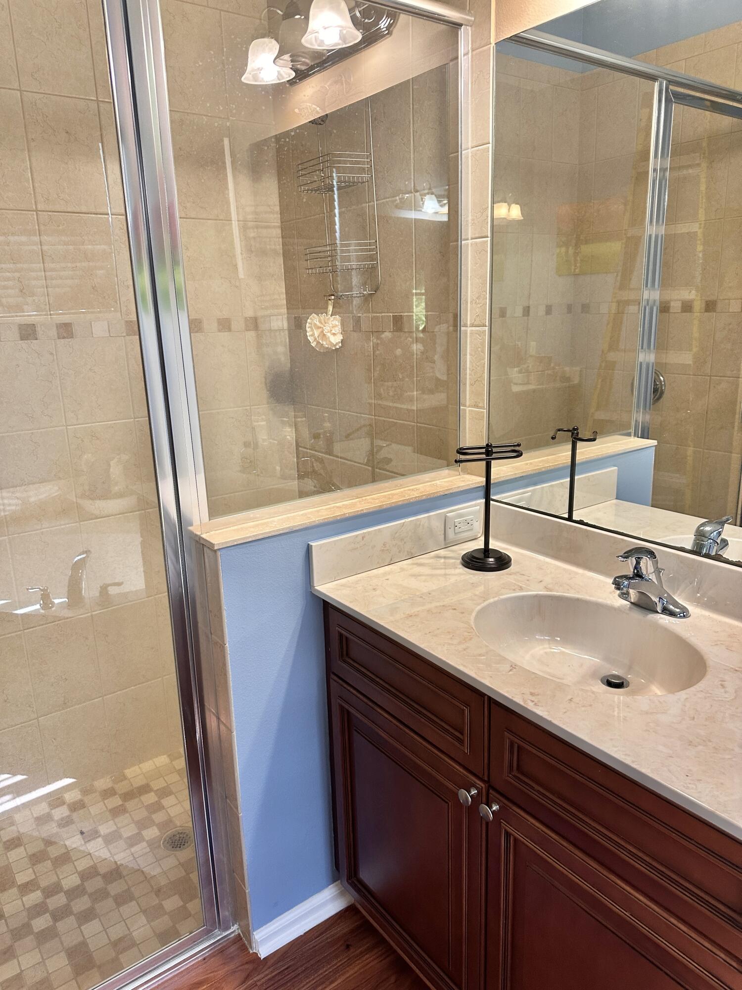 14085 86th Road North Loxahatchee, FL 33470 - Photo 23 of 28 a bathroom with a sink and a mirror