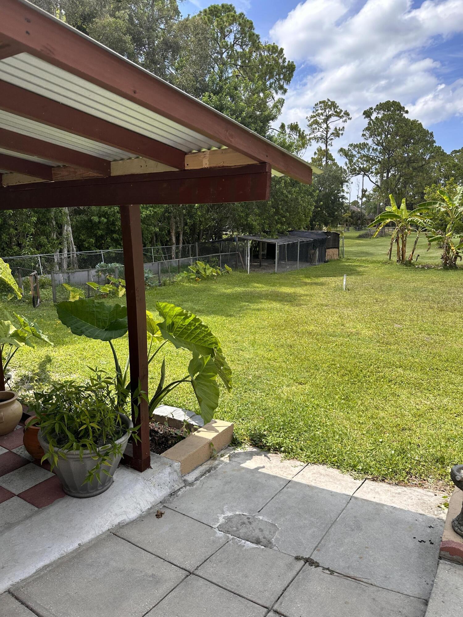 14085 86th Road North Loxahatchee, FL 33470 - Photo 7 of 28 a view of a house with a yard