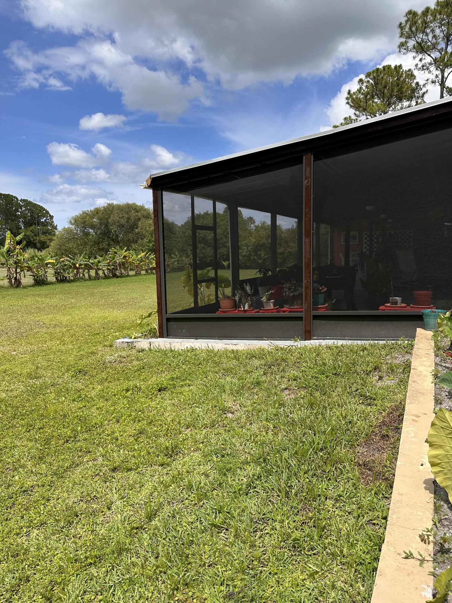 14085 86th Road North Loxahatchee, FL 33470 - Photo 8 of 28 a view of an ocean from a balcony