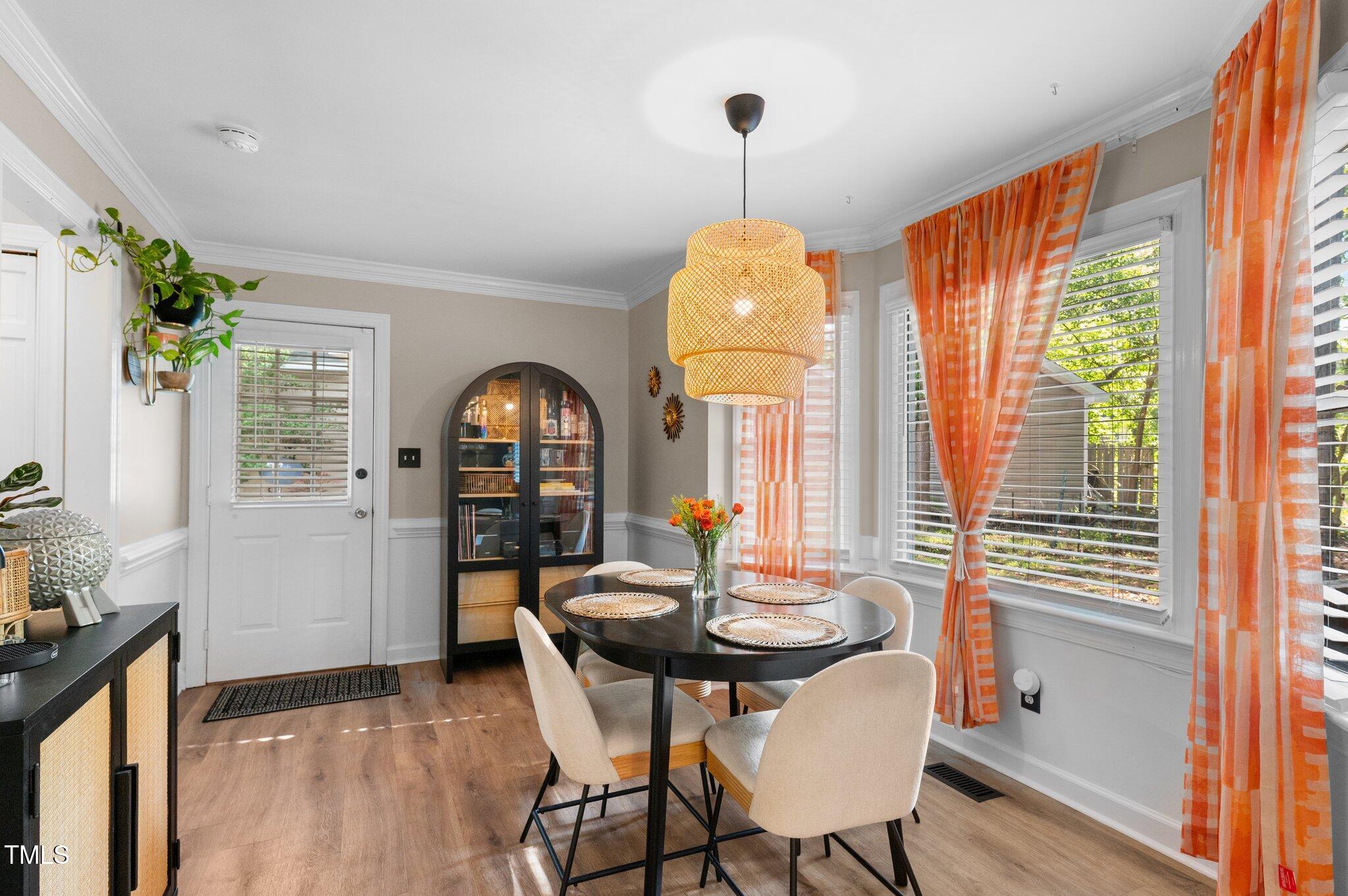 3541 East Jameson Road Raleigh, NC 27604 - Photo 13 of 38 a view of a dining room with furniture window and wooden floor