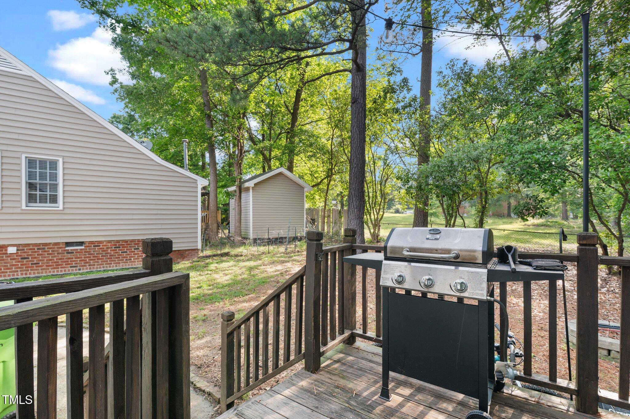 3541 East Jameson Road Raleigh, NC 27604 - Photo 15 of 38 a view of a deck with wooden floor and fence