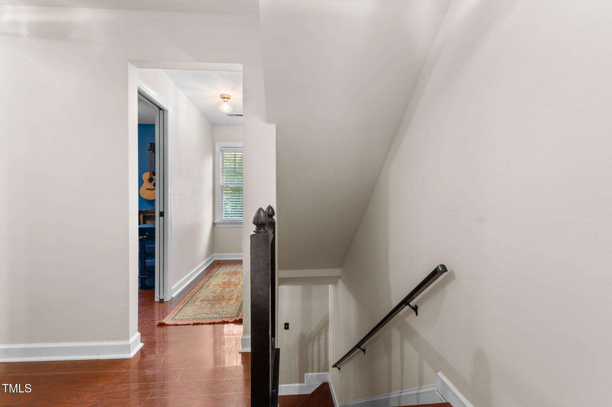 3541 East Jameson Road Raleigh, NC 27604 - Photo 16 of 38 a view of a hallway with a room and stairs