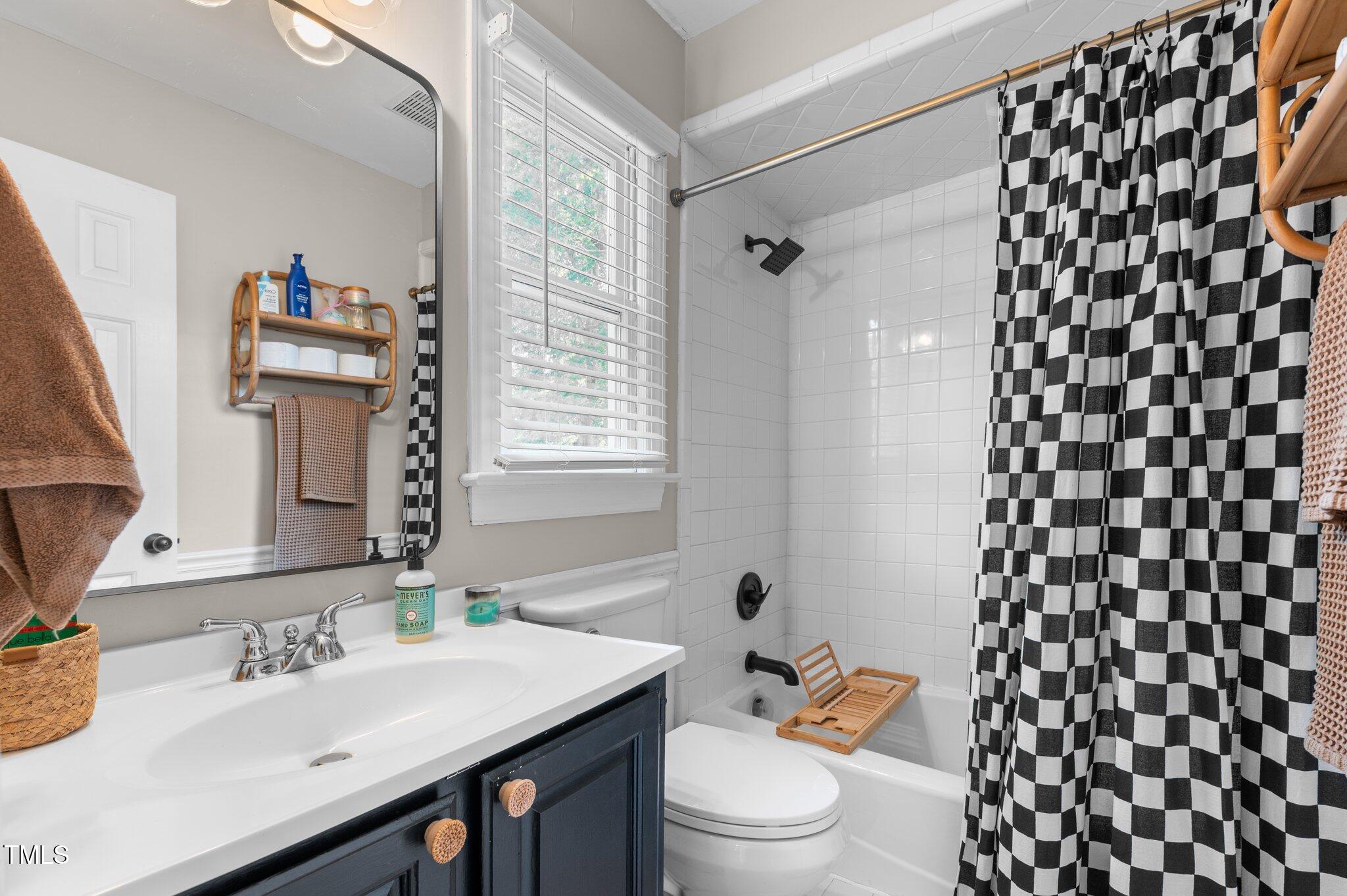 3541 East Jameson Road Raleigh, NC 27604 - Photo 17 of 38 a bathroom with a sink a toilet and shower