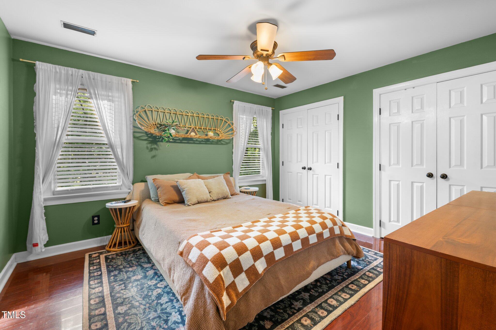3541 East Jameson Road Raleigh, NC 27604 - Photo 21 of 38 a bedroom with a bed and a chandelier