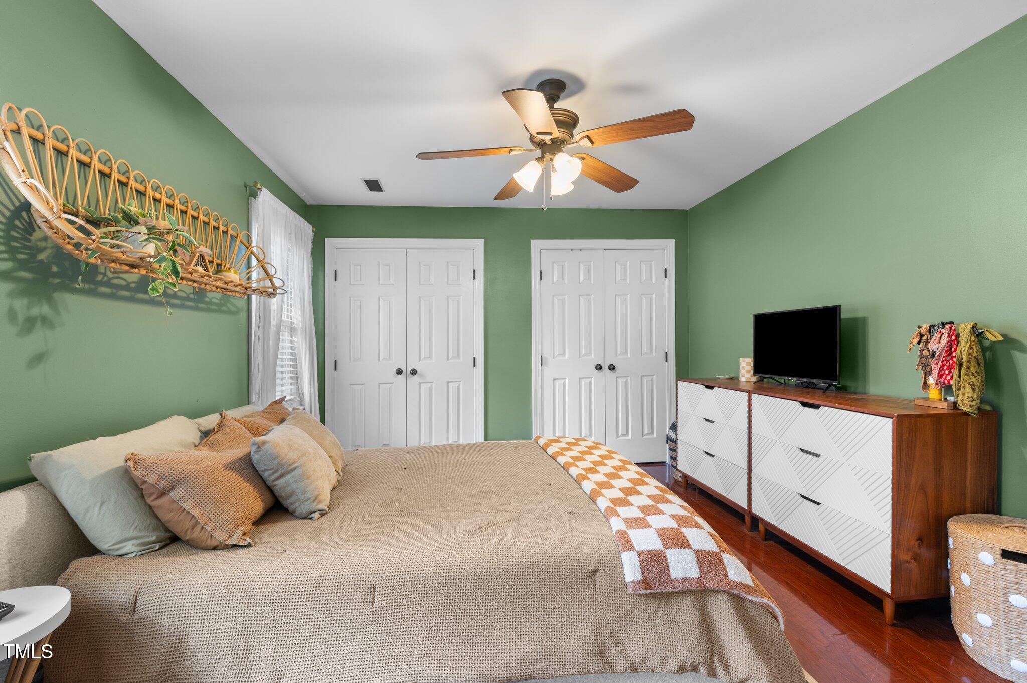 3541 East Jameson Road Raleigh, NC 27604 - Photo 22 of 38 a bedroom with a bed and a flat screen tv