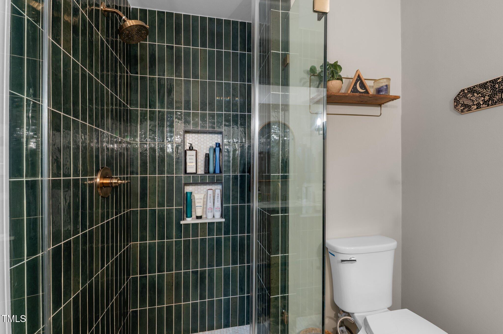 3541 East Jameson Road Raleigh, NC 27604 - Photo 24 of 38 a bathroom with a toilet and a shower