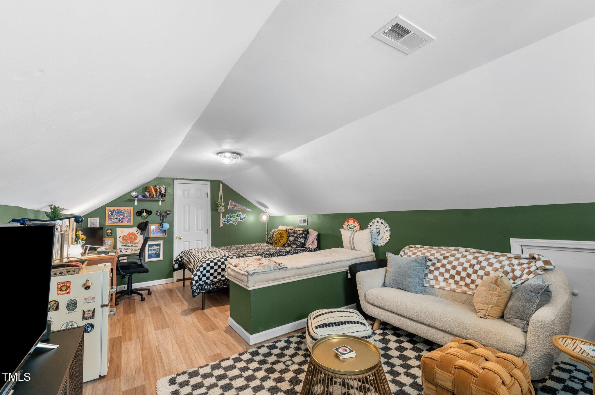 3541 East Jameson Road Raleigh, NC 27604 - Photo 26 of 38 a living room with furniture and a wooden floor