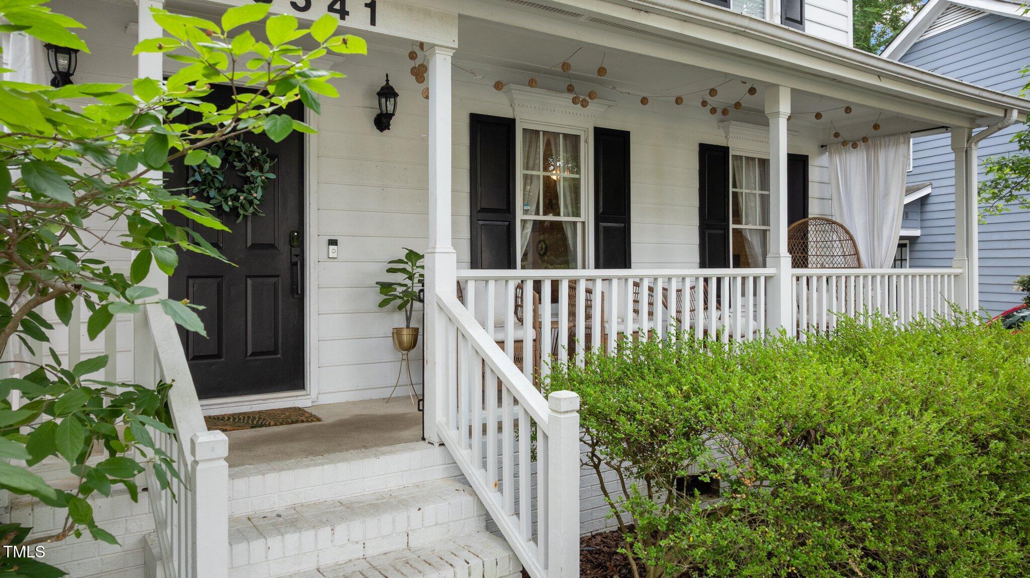 3541 East Jameson Road Raleigh, NC 27604 - Photo 6 of 38 a view of a house with a flower plants