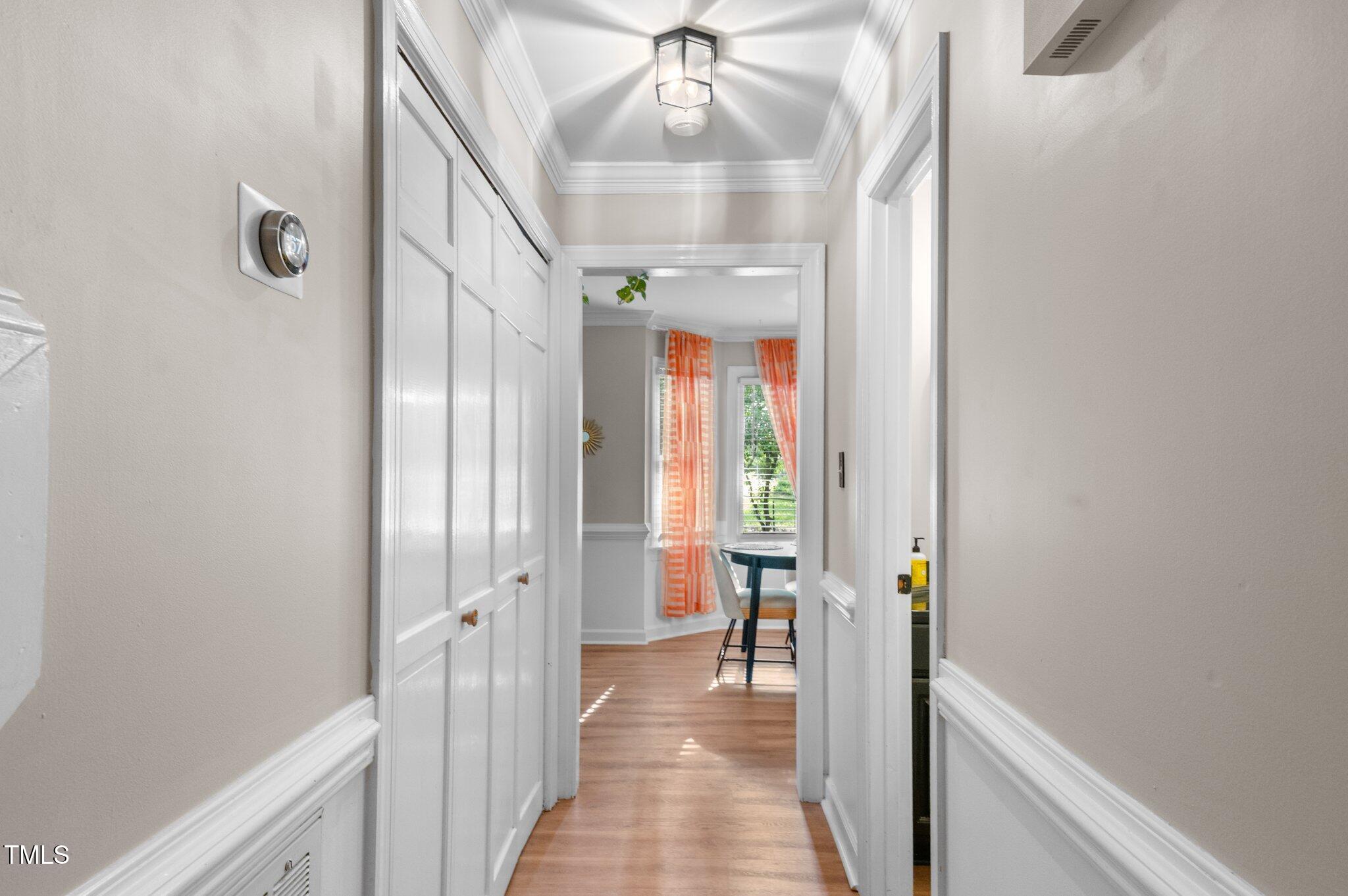 3541 East Jameson Road Raleigh, NC 27604 - Photo 9 of 38 a view of a hallway view with wooden floor and staircase