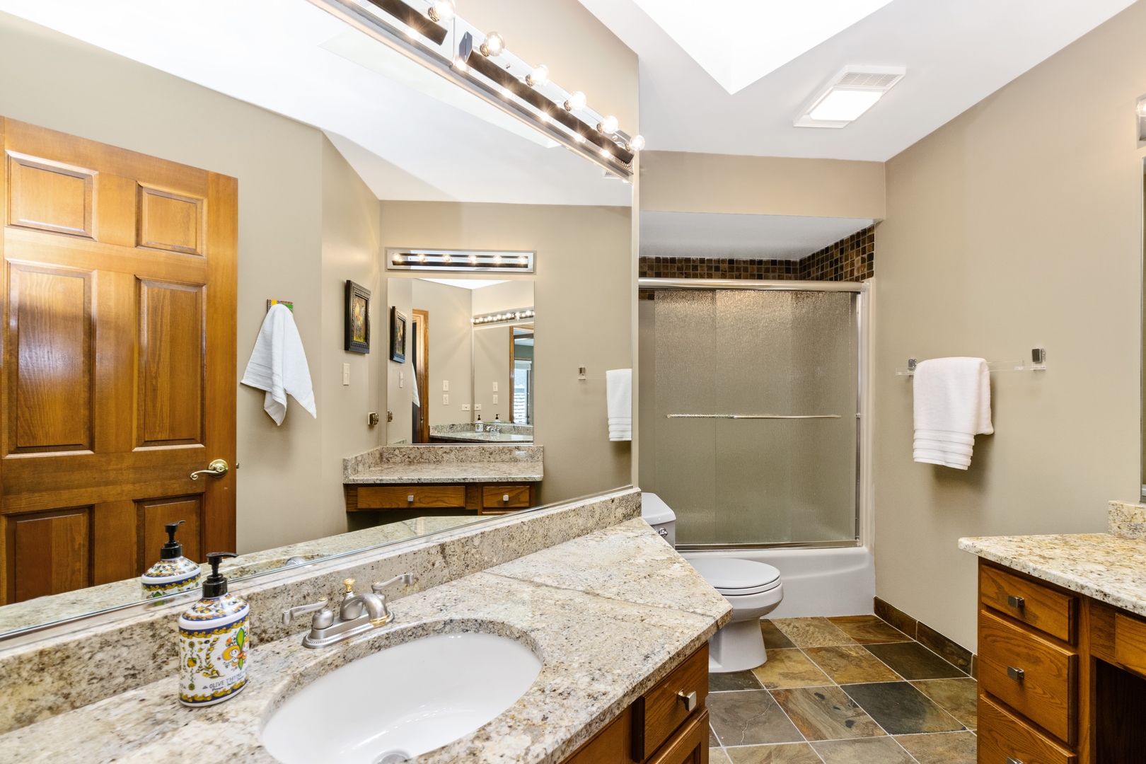 13610 South Kickapoo Trail Homer Glen, IL 60491 - Photo 19 of 37 a bathroom with a granite countertop sink and a mirror