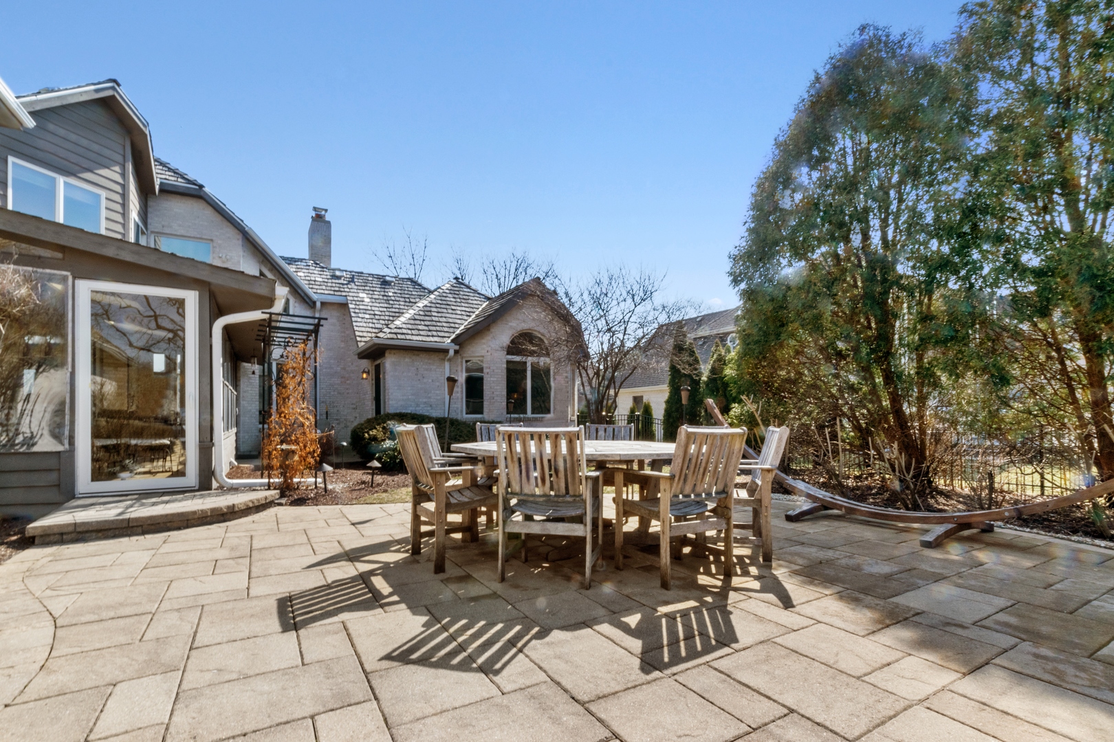 13610 South Kickapoo Trail Homer Glen, IL 60491 - Photo 3 of 37 a view of a patio with table and chairs and potted plants