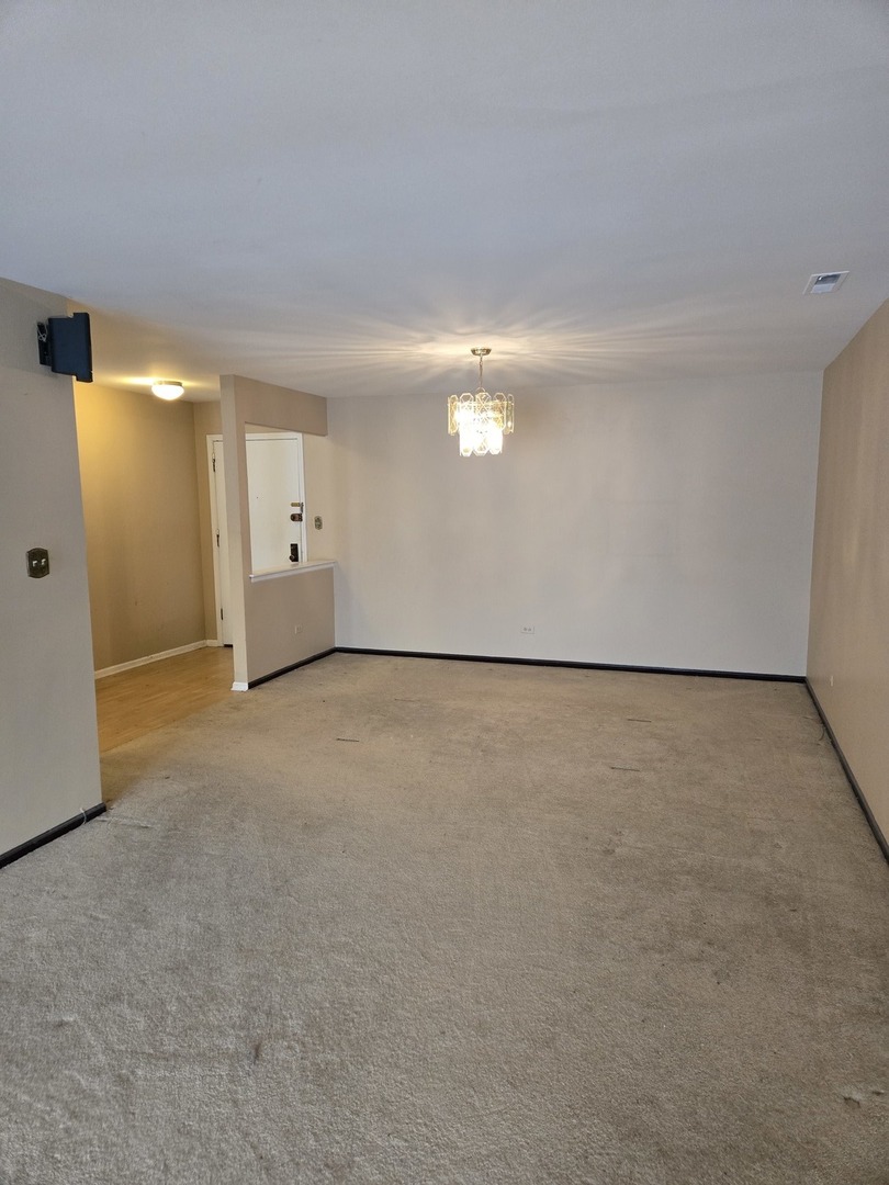 9242 Gross Point Road, Unit 107 Skokie, IL 60077 - Photo 12 of 13 a view of an empty room