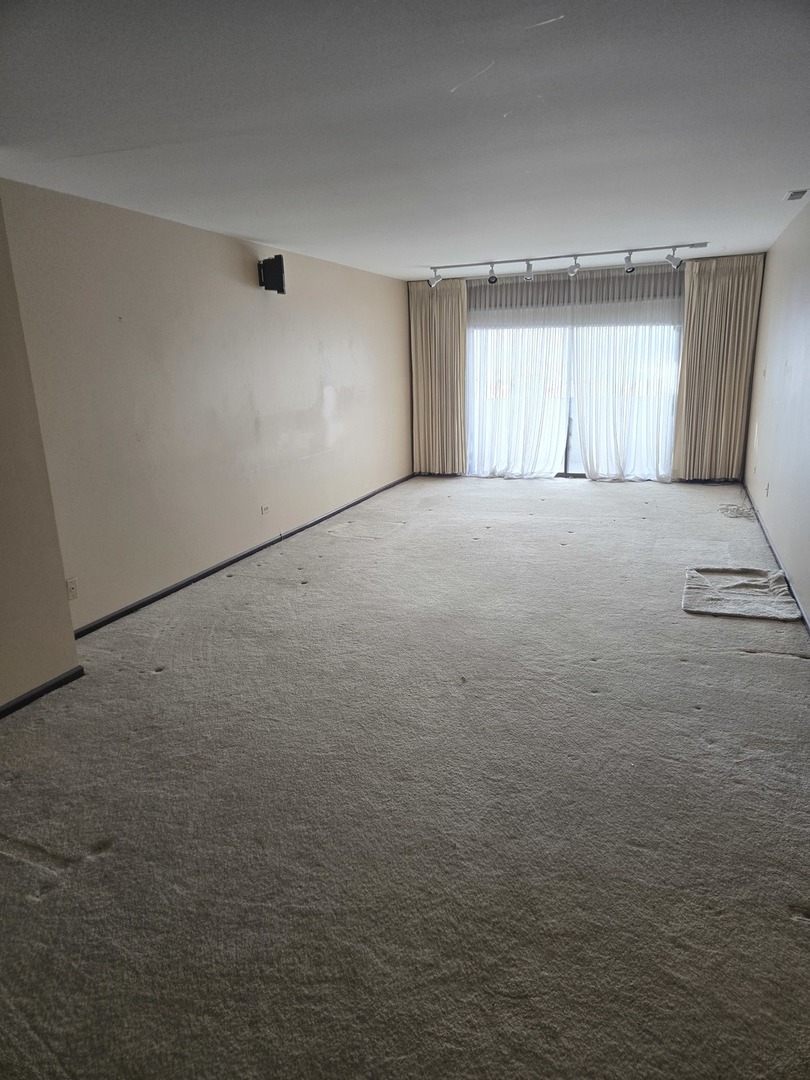 9242 Gross Point Road, Unit 107 Skokie, IL 60077 - Photo 13 of 13 a view of empty room