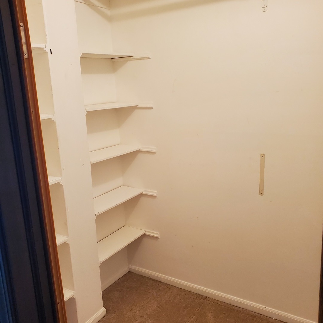 9242 Gross Point Road, Unit 107 Skokie, IL 60077 - Photo 6 of 13 a view of an empty walk in closet