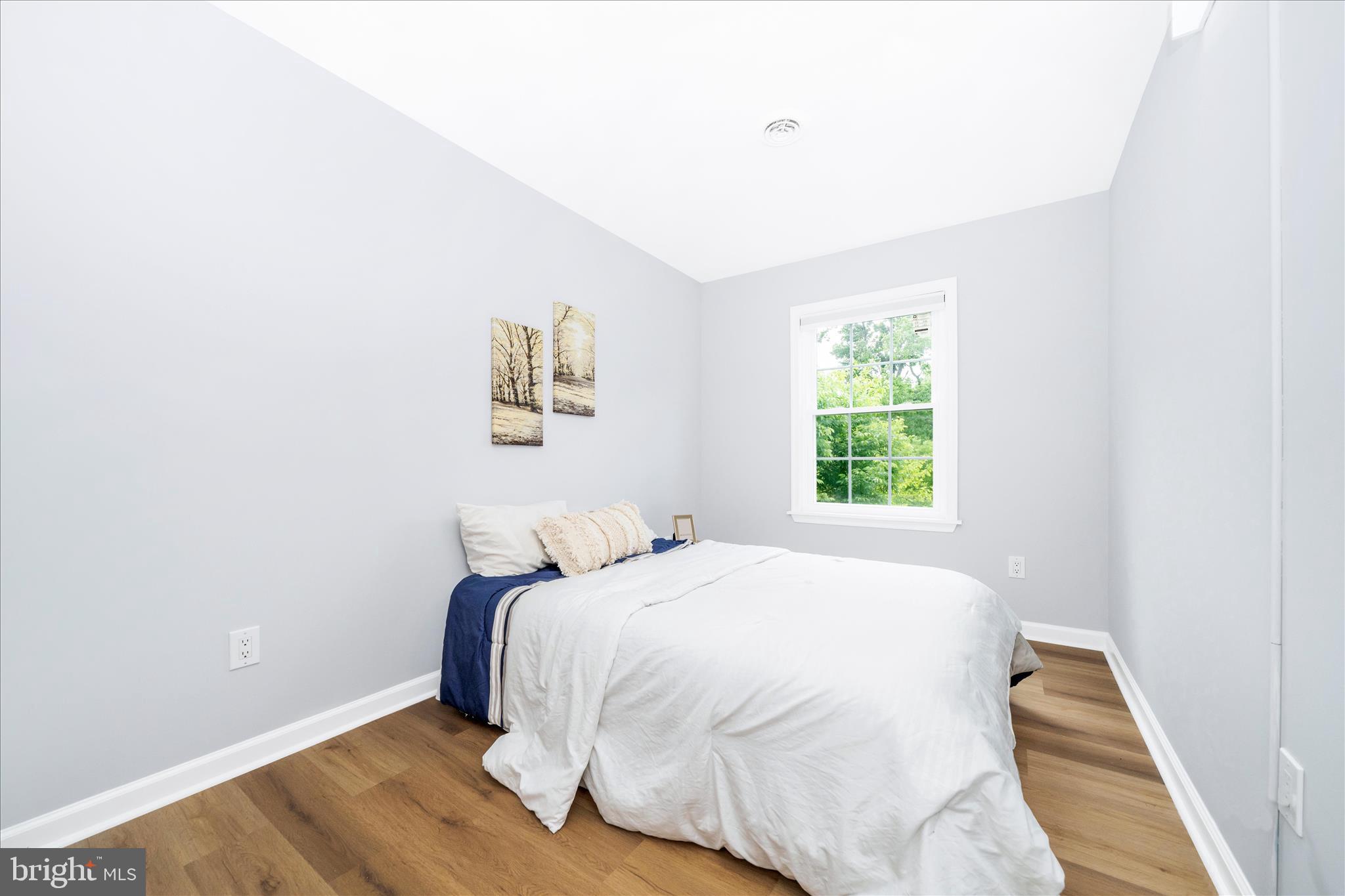 713 Seek Lane Silver Spring, MD 20912 - Photo 19 of 60 a bedroom with a bed and a window