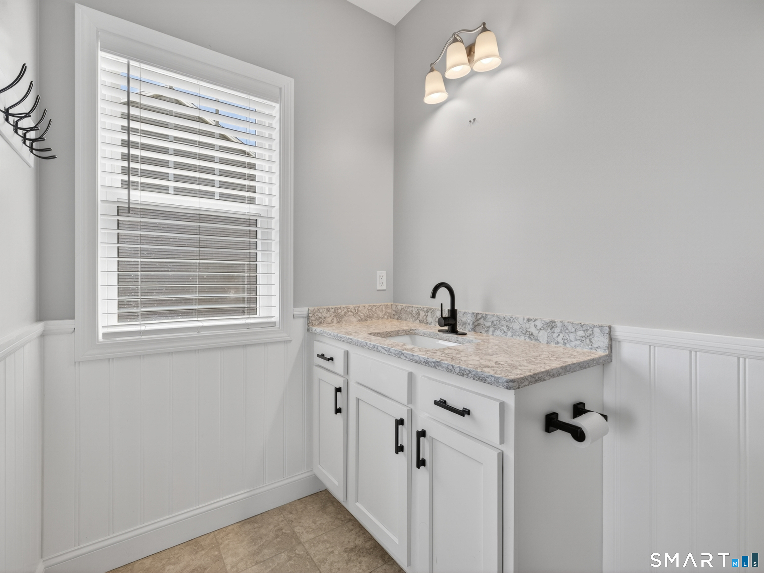 650 Ridgewood Road Middletown, CT 06457 - Photo 21 of 40 a bathroom with a granite countertop sink and a mirror