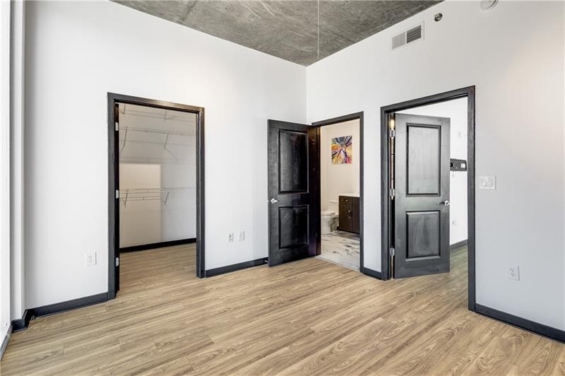 3324 Peachtree Road Northeast, Unit 1419 Atlanta, GA 30326 - Photo 12 of 43 a view of an empty room with wooden floor