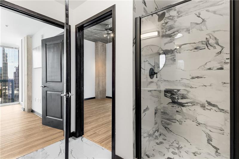 3324 Peachtree Road Northeast, Unit 1419 Atlanta, GA 30326 - Photo 15 of 43 a view of a bathroom from a hallway