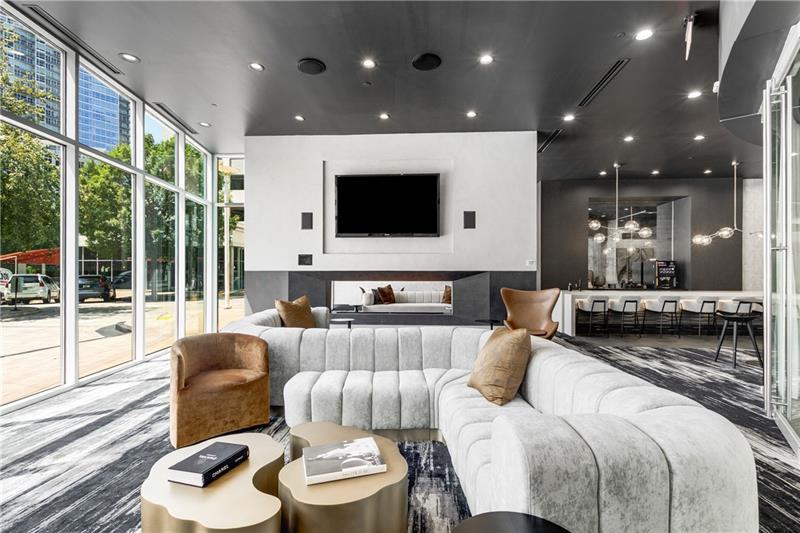 3324 Peachtree Road Northeast, Unit 1419 Atlanta, GA 30326 - Photo 23 of 43 a living room with furniture and a flat screen tv