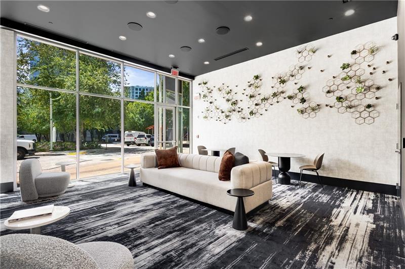 3324 Peachtree Road Northeast, Unit 1419 Atlanta, GA 30326 - Photo 24 of 43 a living room with furniture and a large window