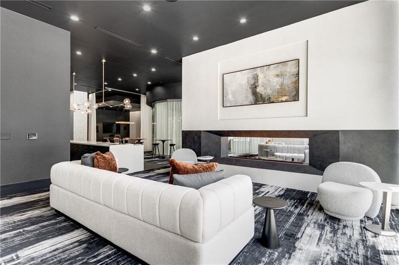 3324 Peachtree Road Northeast, Unit 1419 Atlanta, GA 30326 - Photo 25 of 43 a living room with furniture and a large mirror