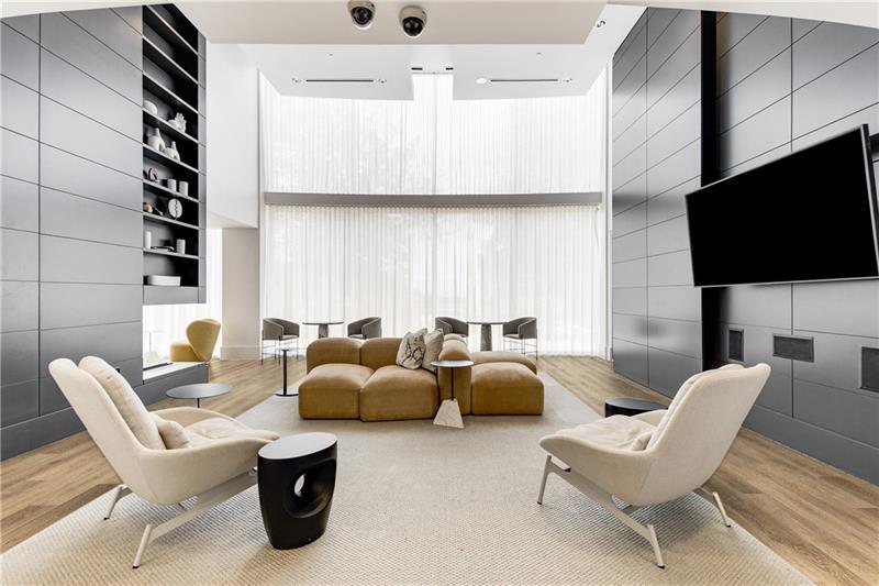 3324 Peachtree Road Northeast, Unit 1419 Atlanta, GA 30326 - Photo 26 of 43 a living room with furniture and a flat screen tv