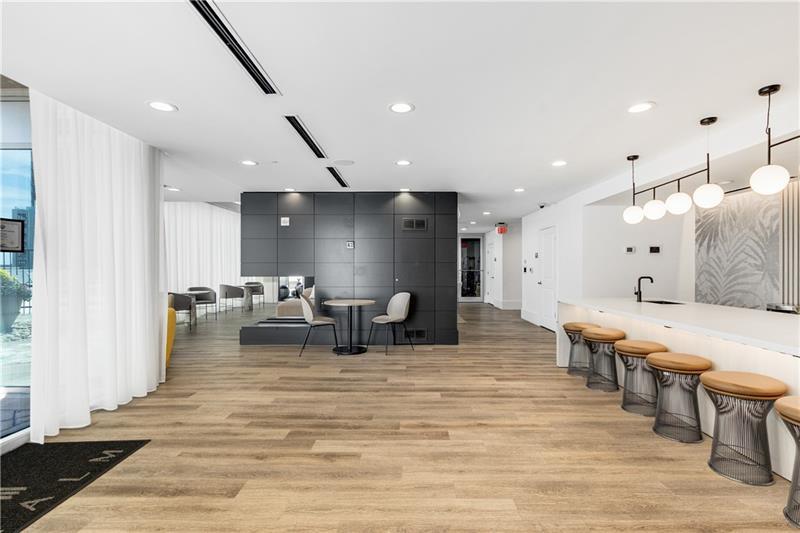 3324 Peachtree Road Northeast, Unit 1419 Atlanta, GA 30326 - Photo 28 of 43 a large room with lots of furniture and a wooden floor