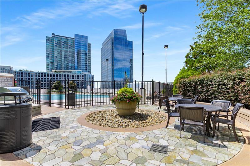 3324 Peachtree Road Northeast, Unit 1419 Atlanta, GA 30326 - Photo 32 of 43 a view of a patio with a table and chairs
