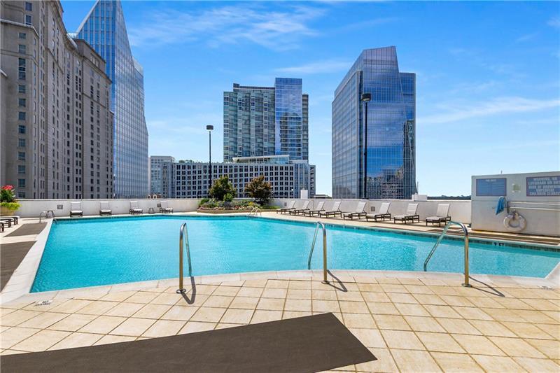 3324 Peachtree Road Northeast, Unit 1419 Atlanta, GA 30326 - Photo 33 of 43 a kitchen with a sink and cabinets
