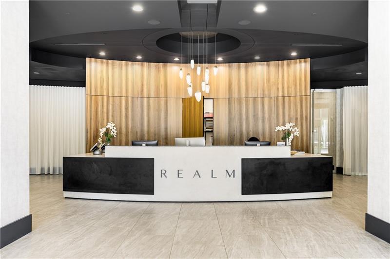 3324 Peachtree Road Northeast, Unit 1419 Atlanta, GA 30326 - Photo 42 of 43 a view of kitchen with stainless steel appliances wooden floor and chandelier