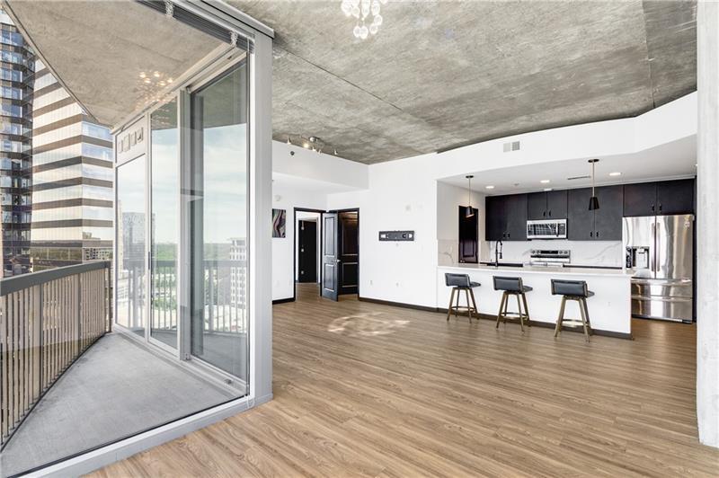 3324 Peachtree Road Northeast, Unit 1419 Atlanta, GA 30326 - Photo 5 of 43 a view of kitchen with furniture and wooden floor