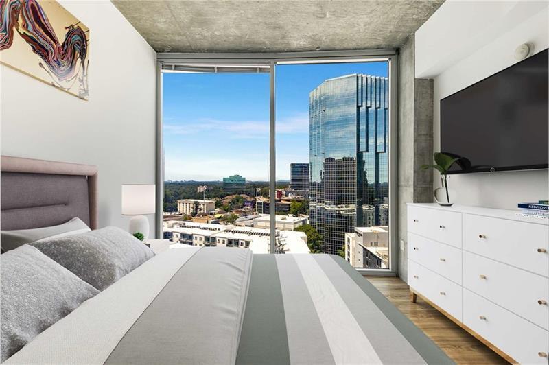 3324 Peachtree Road Northeast, Unit 1419 Atlanta, GA 30326 - Photo 6 of 43 a living room with furniture and a flat screen tv