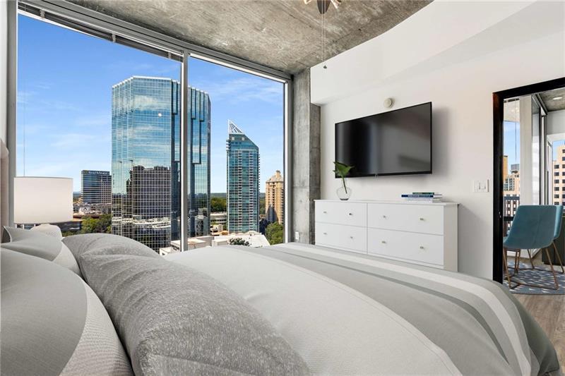 3324 Peachtree Road Northeast, Unit 1419 Atlanta, GA 30326 - Photo 7 of 43 a view of a bedroom with flat screen tv and a bed