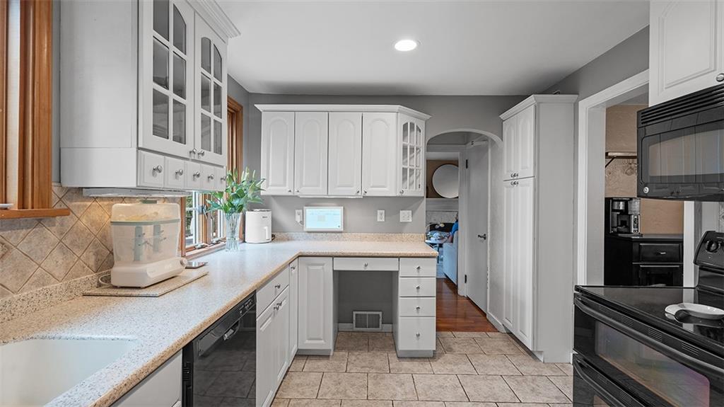 4720 Rolling Hills Road Pittsburgh, PA 15236 - Photo 12 of 34 a kitchen with a sink cabinets and stainless steel appliances