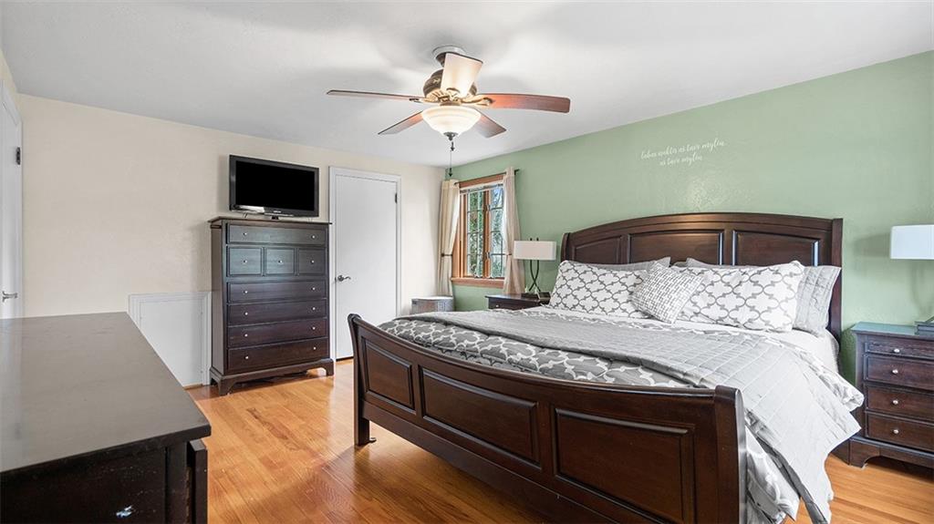 4720 Rolling Hills Road Pittsburgh, PA 15236 - Photo 17 of 34 a bedroom with a bed and a television