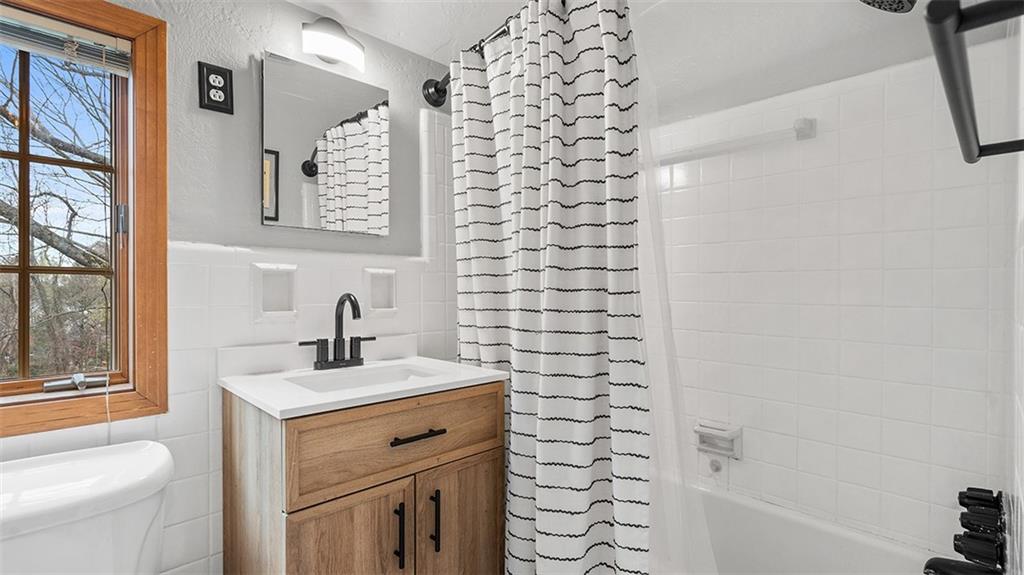 4720 Rolling Hills Road Pittsburgh, PA 15236 - Photo 18 of 34 a bathroom with a sink toilet and shower