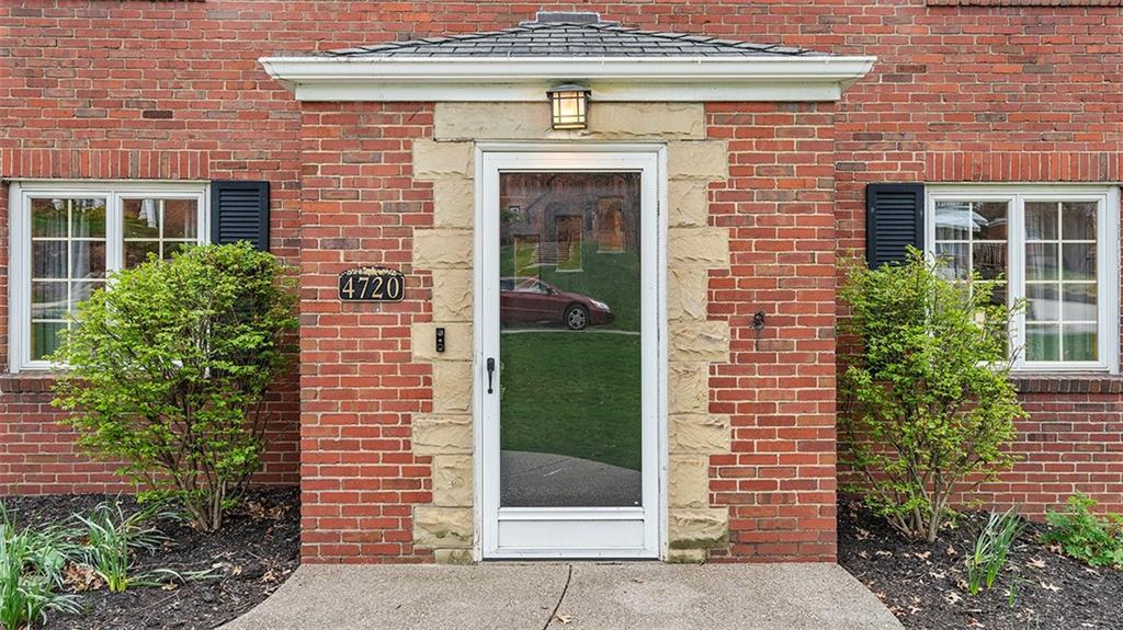 4720 Rolling Hills Road Pittsburgh, PA 15236 - Photo 2 of 34 a front view of a house with garden