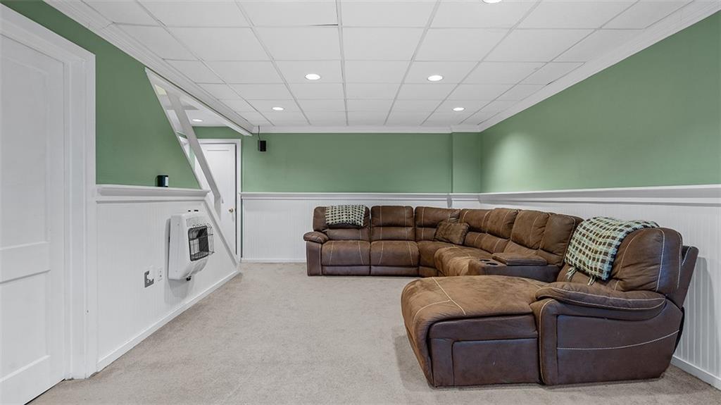 4720 Rolling Hills Road Pittsburgh, PA 15236 - Photo 23 of 34 a living room with furniture and a fireplace