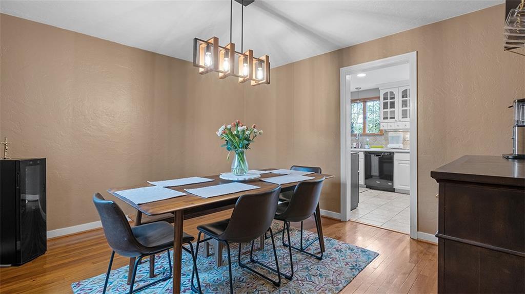 4720 Rolling Hills Road Pittsburgh, PA 15236 - Photo 7 of 34 a view of a dining room with furniture and wooden floor