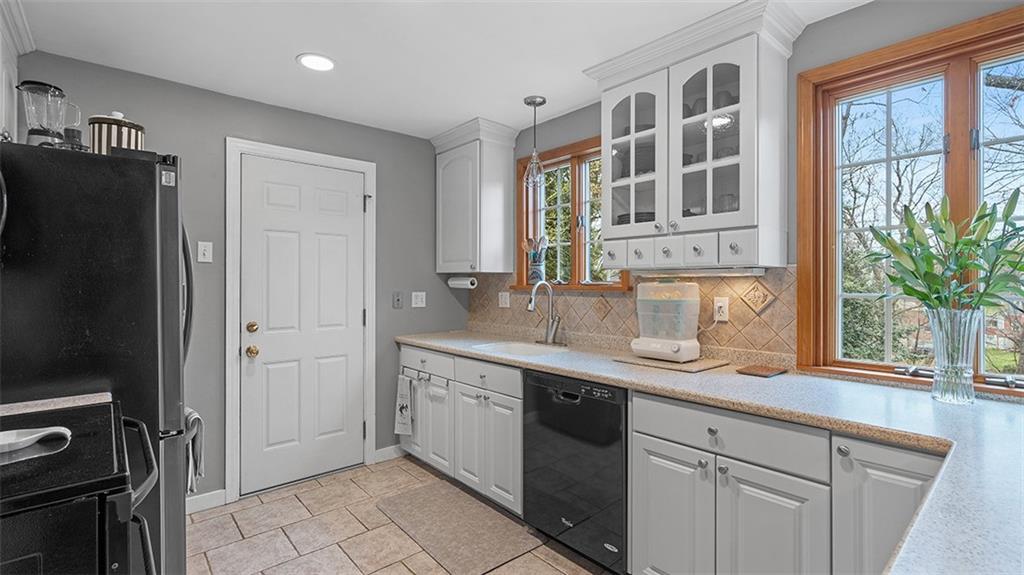 4720 Rolling Hills Road Pittsburgh, PA 15236 - Photo 9 of 34 a kitchen with a sink stainless steel appliances and cabinets
